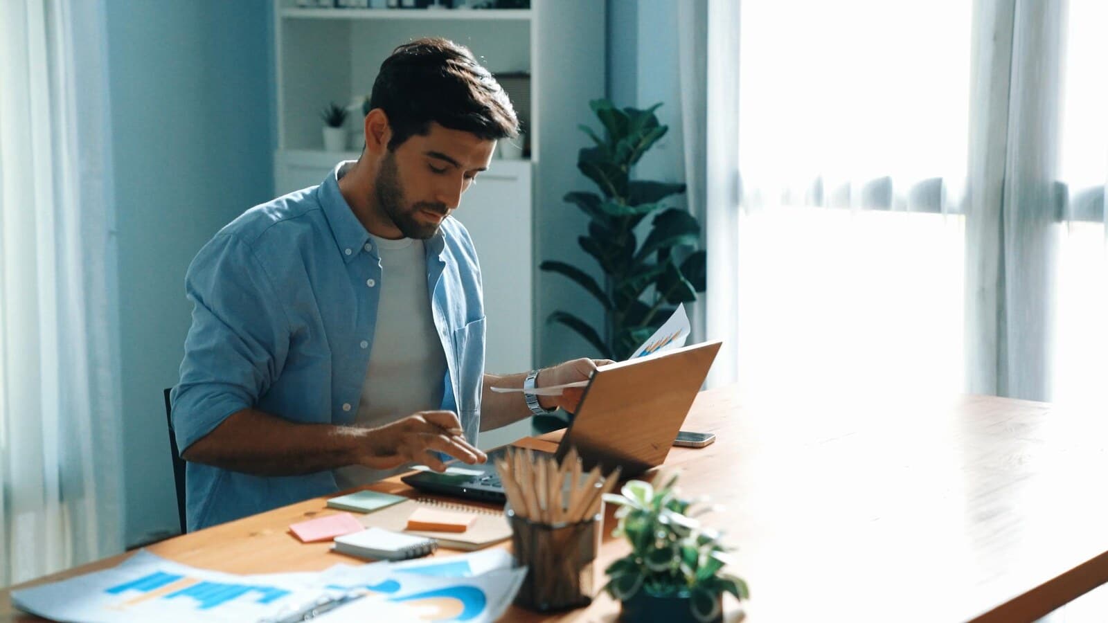 Indian digital marketer checking salary growth and analytics on a laptop