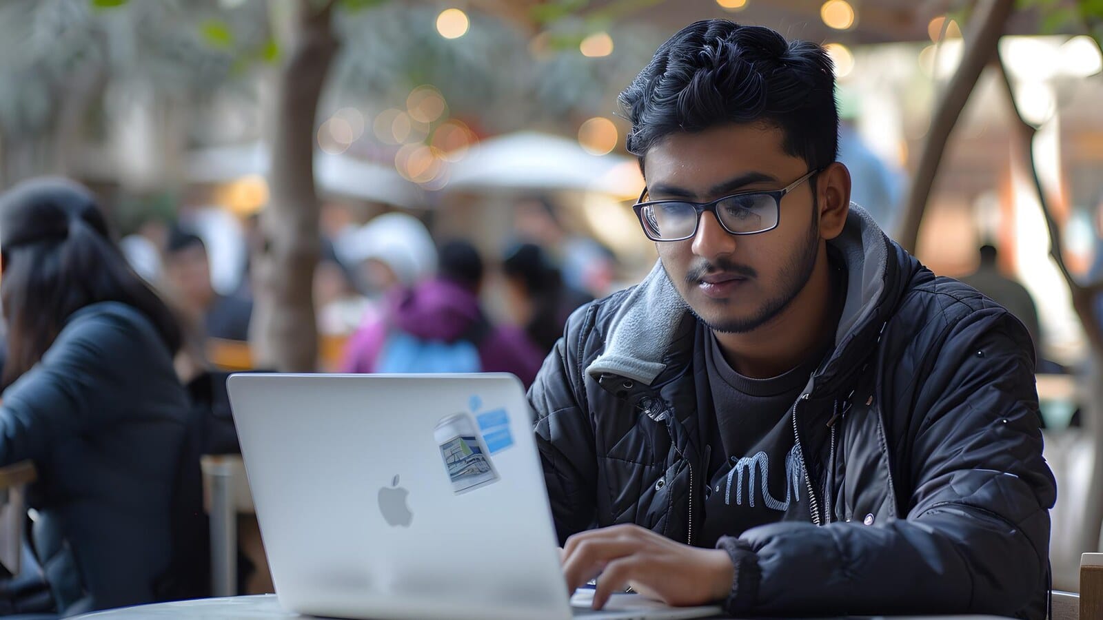 Student comparing MBA in digital marketing options on a laptop