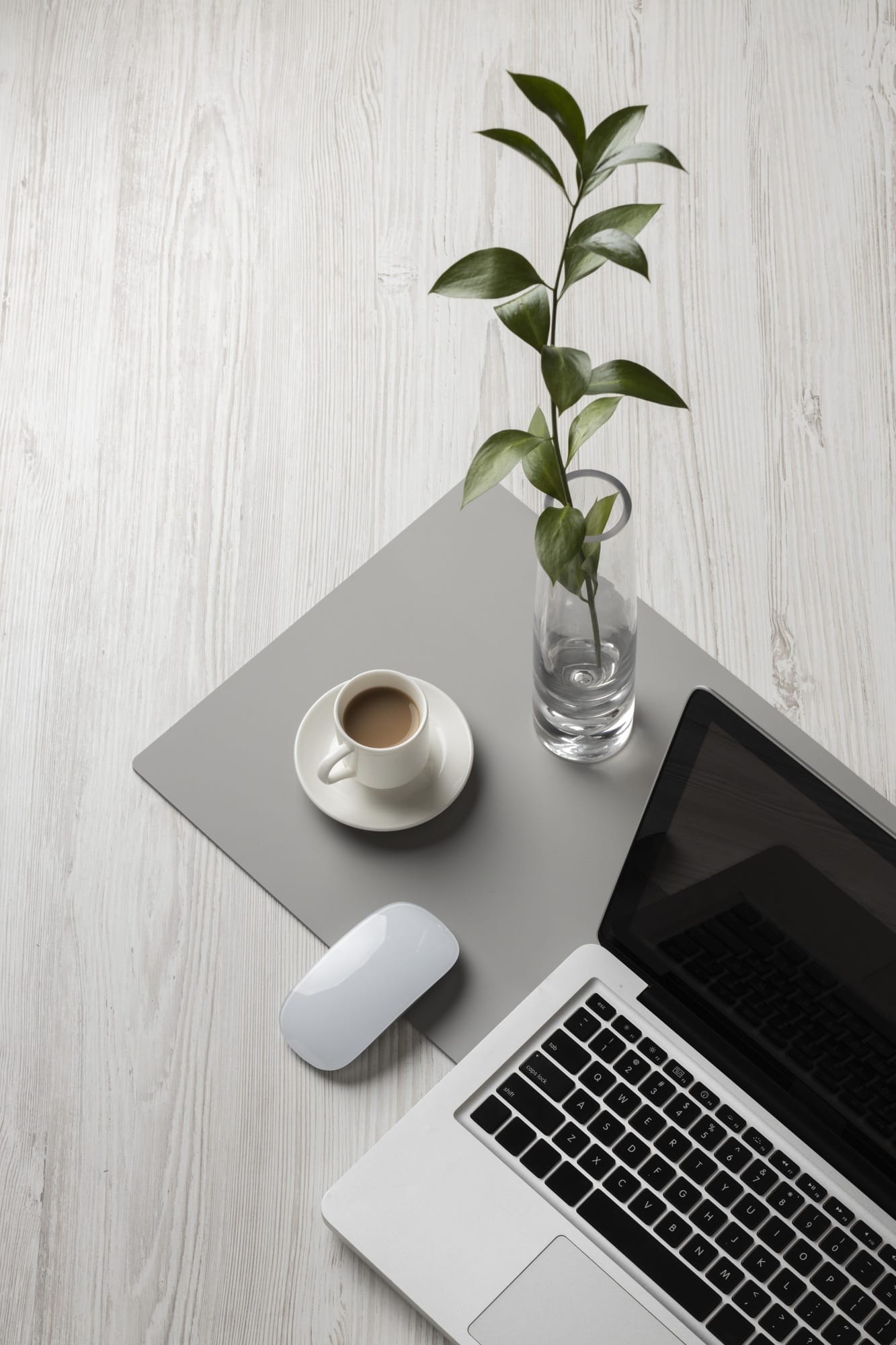 Minimal desk setup for software company founder building a client sales system